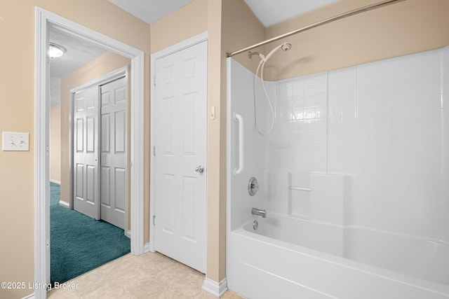 bathroom featuring  shower combination and baseboards