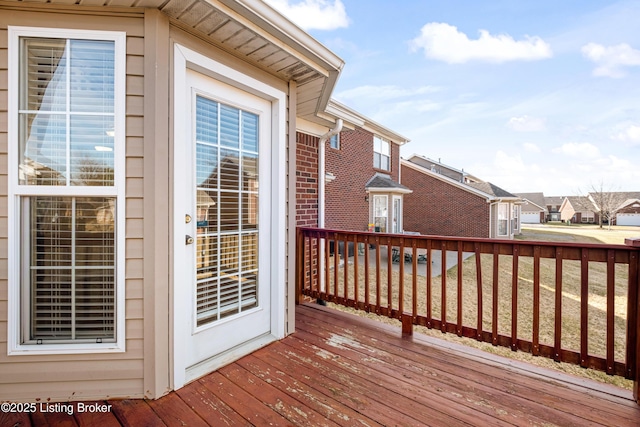 wooden deck with a residential view