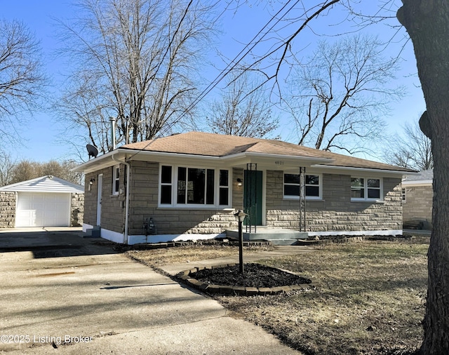 bungalow-style home featuring an outdoor structure, a detached garage, stone siding, concrete driveway, and a chimney