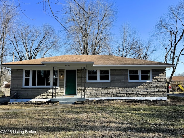 view of front of property featuring stone siding and a front yard