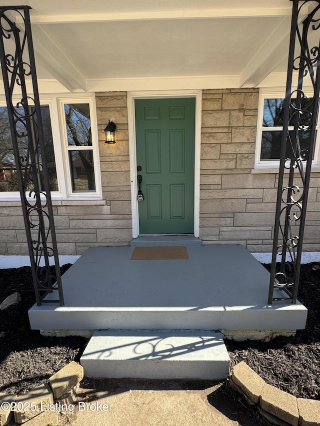 view of exterior entry with stone siding