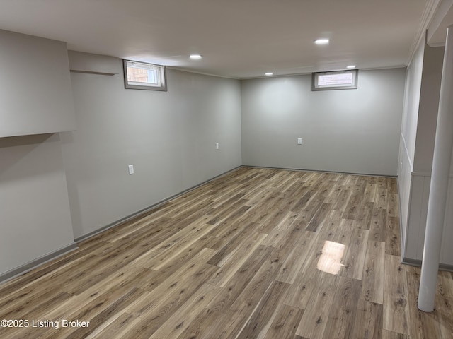 below grade area featuring recessed lighting and light wood finished floors