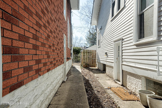 view of side of property with fence