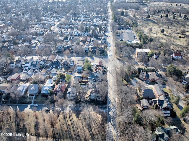 birds eye view of property with a residential view