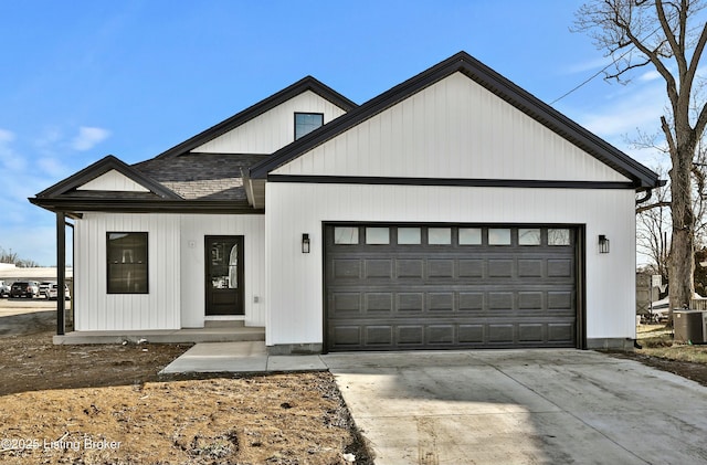 modern farmhouse style home with central AC, concrete driveway, roof with shingles, and an attached garage