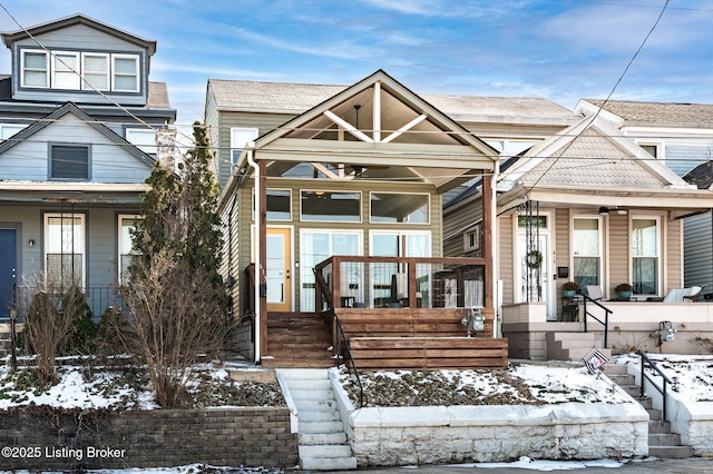 view of front of house with covered porch and roof with shingles