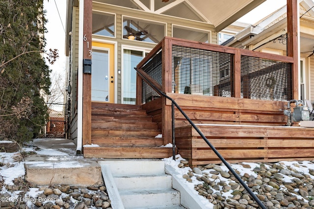 view of snow covered property entrance