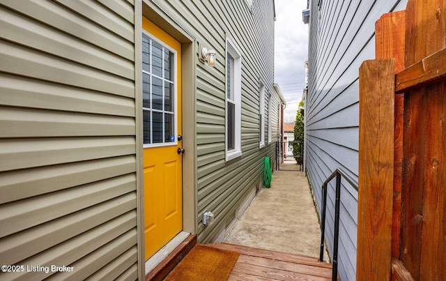 view of side of property featuring fence