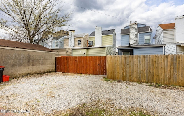 view of yard with a residential view and fence