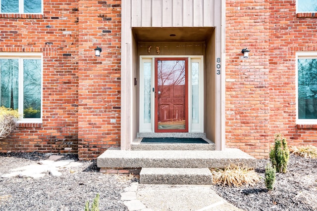 entrance to property with brick siding