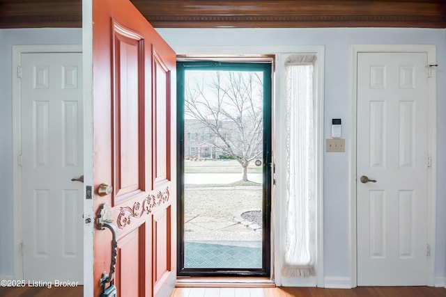 foyer entrance with light wood-type flooring