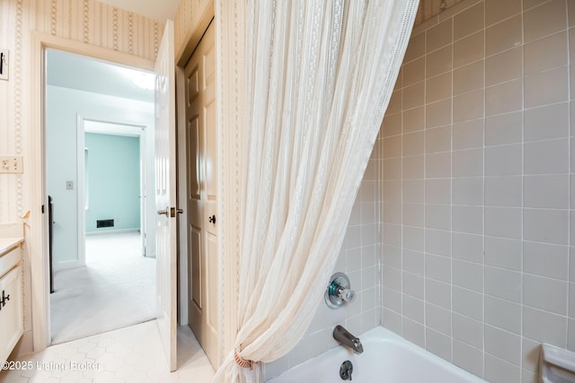 bathroom featuring shower / bath combo, visible vents, tile patterned floors, and wallpapered walls