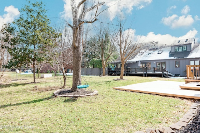 view of yard with fence and a wooden deck