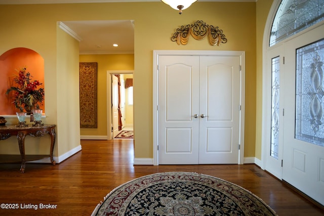 entrance foyer featuring ornamental molding, recessed lighting, baseboards, and wood finished floors