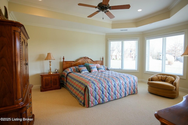 bedroom featuring light carpet, baseboards, a tray ceiling, crown molding, and recessed lighting