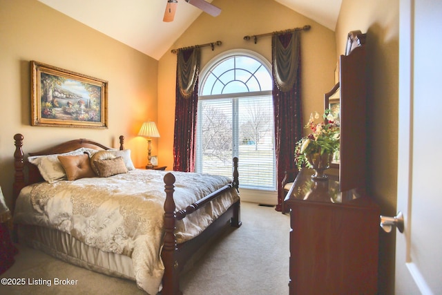 carpeted bedroom featuring lofted ceiling and ceiling fan