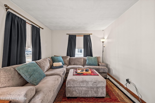 living room with plenty of natural light and baseboards