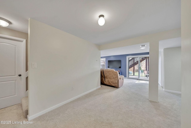 interior space with carpet, visible vents, and baseboards