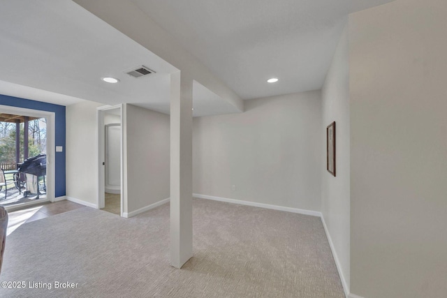 basement with light colored carpet, visible vents, baseboards, and recessed lighting