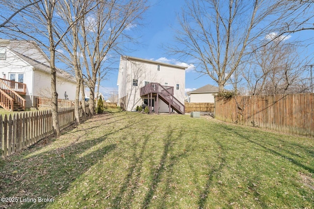 view of yard with stairs, a fenced backyard, and a wooden deck