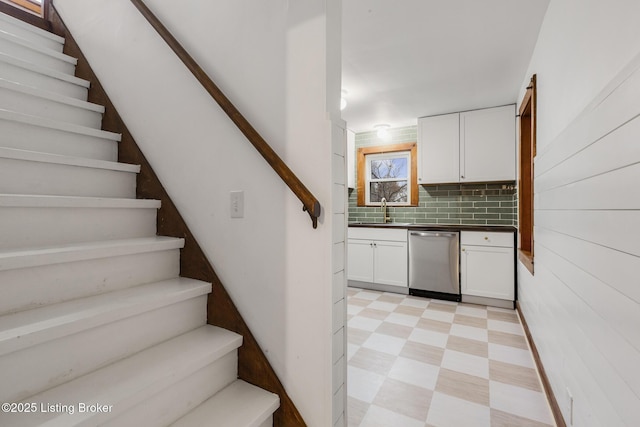 stairs featuring tile patterned floors