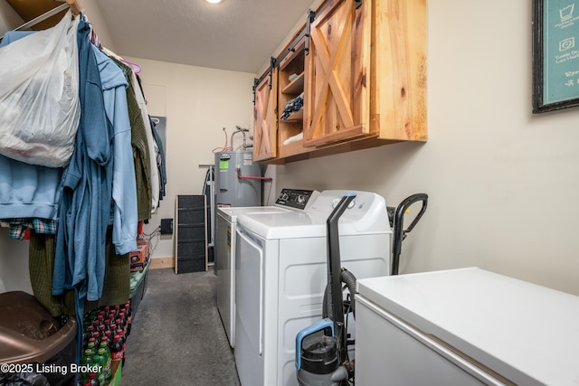 laundry room featuring cabinet space, washing machine and clothes dryer, and water heater