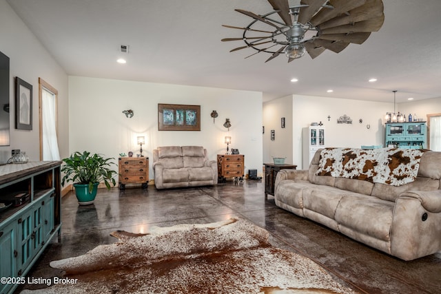 living area with visible vents, concrete flooring, and recessed lighting