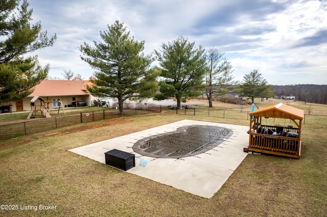 exterior space featuring a lawn, a patio, a gazebo, and fence