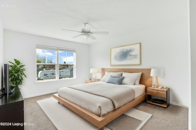 bedroom featuring carpet flooring, a ceiling fan, and baseboards