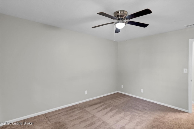 carpeted empty room with visible vents and baseboards