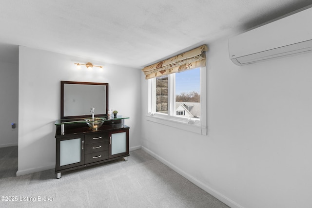 interior space featuring light carpet, a wall mounted air conditioner, and baseboards