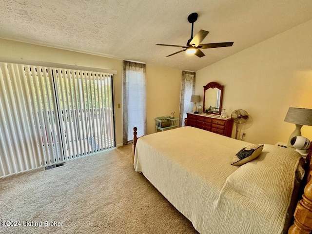 bedroom featuring visible vents, light colored carpet, access to exterior, vaulted ceiling, and a textured ceiling