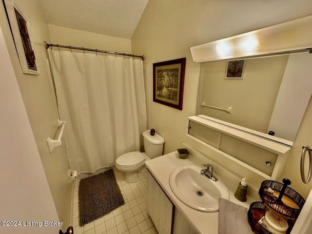 bathroom featuring visible vents, toilet, a textured ceiling, vanity, and tile patterned floors