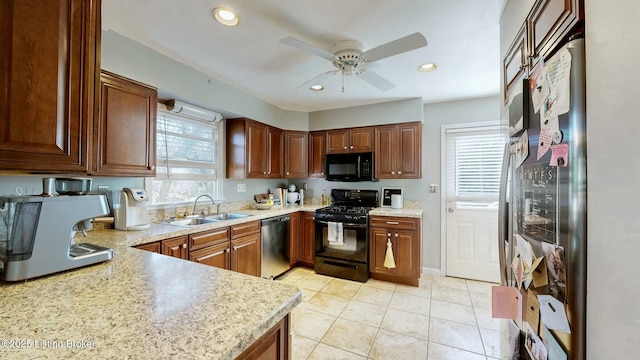 kitchen featuring ceiling fan, recessed lighting, a sink, light countertops, and black appliances