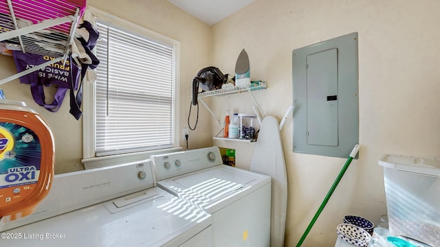 laundry room featuring laundry area, electric panel, and independent washer and dryer