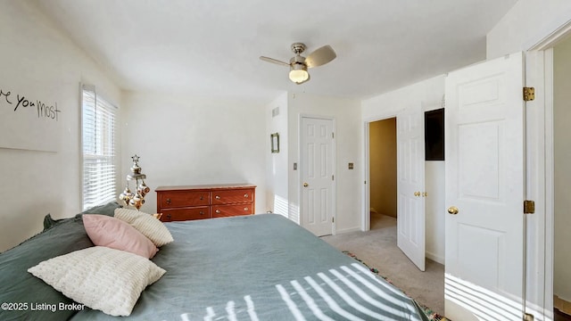 bedroom featuring visible vents, carpet flooring, and a ceiling fan