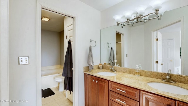 full bathroom featuring a garden tub, double vanity, tile patterned flooring, and a sink