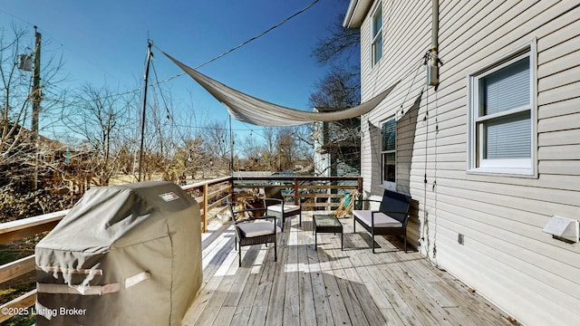 wooden terrace with area for grilling