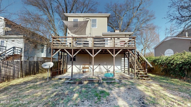 back of house featuring stairs, a chimney, fence, and a wooden deck