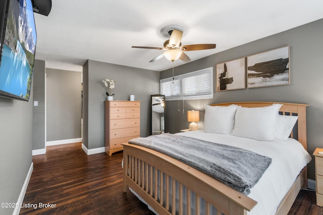 bedroom with dark wood finished floors, baseboards, and ceiling fan