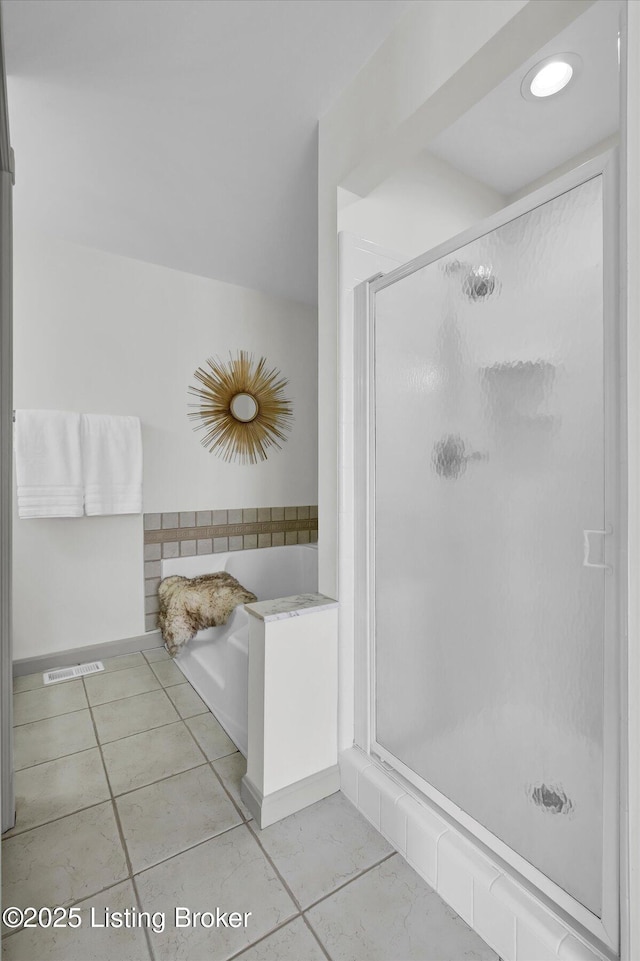 full bath featuring visible vents, a stall shower, tile patterned flooring, and a bath