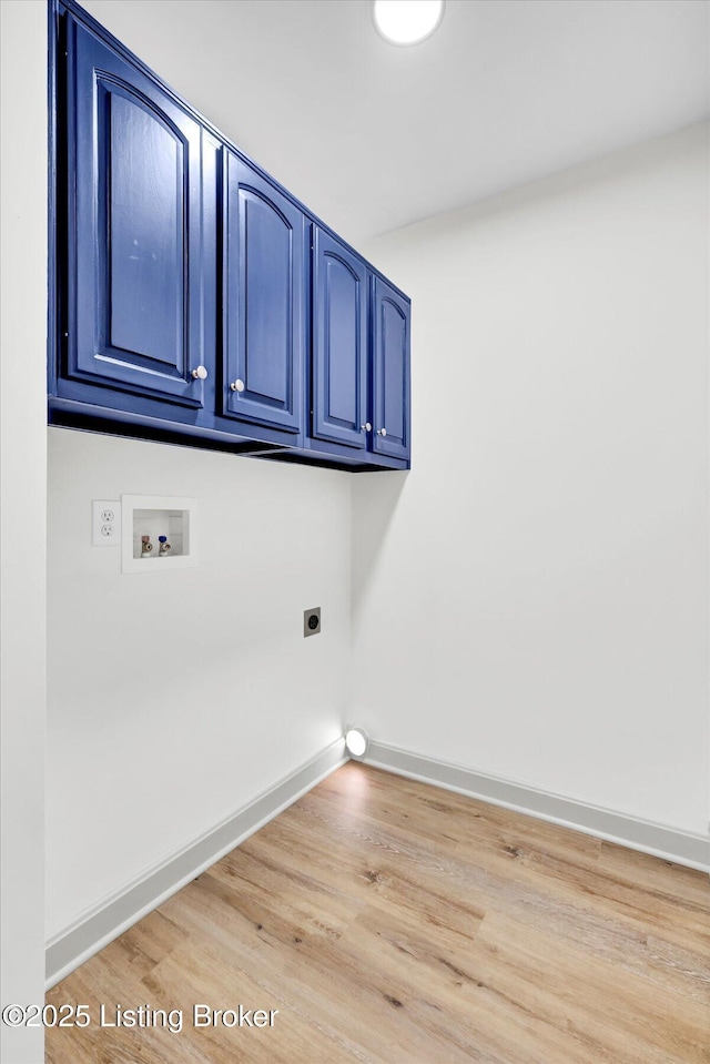 laundry area with washer hookup, wood finished floors, cabinet space, and hookup for an electric dryer