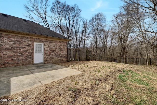 view of yard with a patio and fence