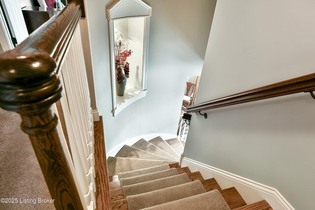 stairs featuring baseboards