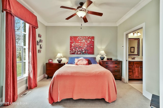 bedroom featuring ornamental molding, light colored carpet, visible vents, and a sink