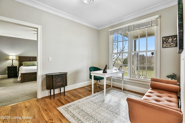 office with baseboards, crown molding, and wood finished floors