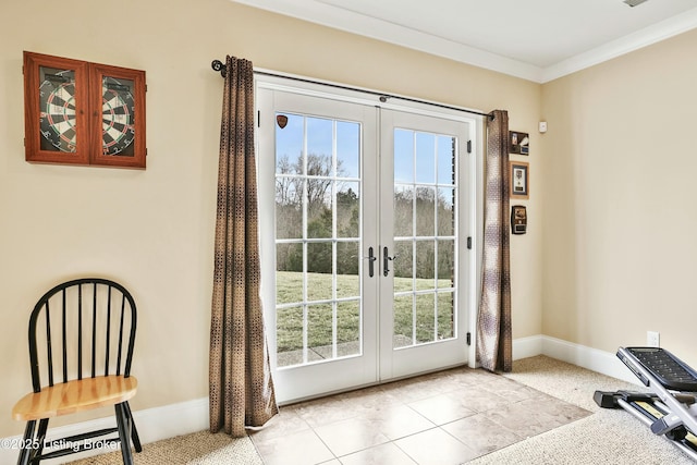 entryway featuring french doors, crown molding, baseboards, and light tile patterned floors