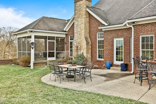 view of patio / terrace with outdoor dining space and a sunroom