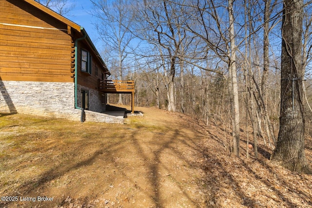 view of yard with a wooden deck