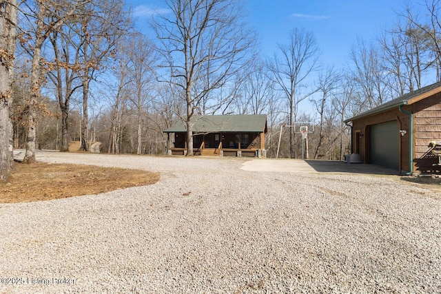 exterior space with gravel driveway